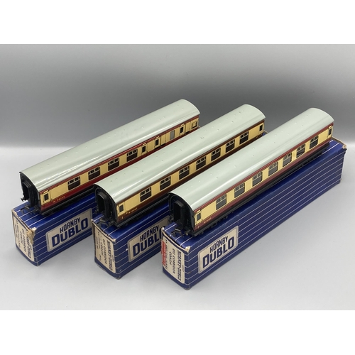 50 - Seven Hornby Dublo 3-rail Coaches comprising pair of D13, D14 Brake with over sticker box, pair D12,... 