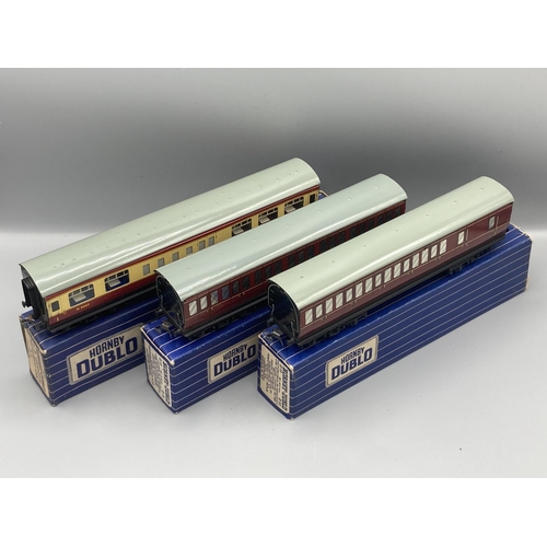 50 - Seven Hornby Dublo 3-rail Coaches comprising pair of D13, D14 Brake with over sticker box, pair D12,... 