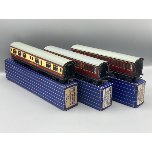 50 - Seven Hornby Dublo 3-rail Coaches comprising pair of D13, D14 Brake with over sticker box, pair D12,... 