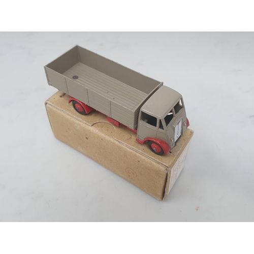 501 - A boxed Dinky Toys No.511 Guy 4-ton Lorry with fawn cab and back and red chassis