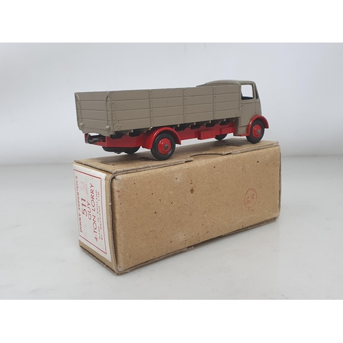 501 - A boxed Dinky Toys No.511 Guy 4-ton Lorry with fawn cab and back and red chassis