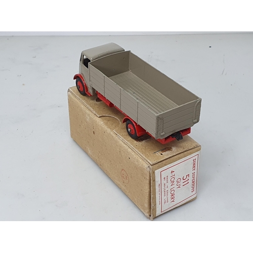 501 - A boxed Dinky Toys No.511 Guy 4-ton Lorry with fawn cab and back and red chassis