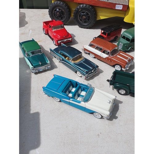 565 - A box of diecast Models including ERTL Case Road Grader, modern Vans and a tinplate flatbed Lorry