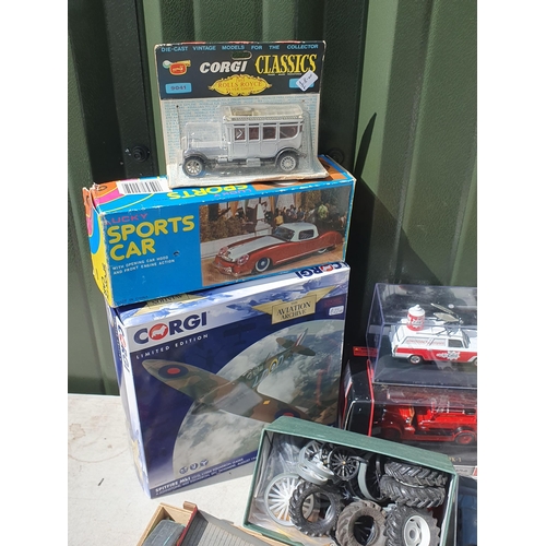 566 - A box of spares and repairs diecast Models, a boxed Corgi Aviation Archive Spitfire and a boxed Luck... 