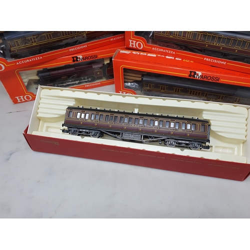 571 - A boxed Rivarossi HO 'Royal Scot' Locomotive, five boxed LMS Coaches and a boxed Fleischmann HO Turn... 