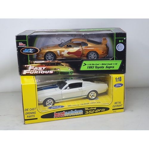 587 - A boxed Racing Champions 1:18 scale Toyota Supra and a boxed Jouef Evolution Ford Mustang