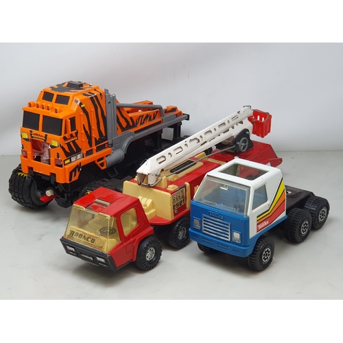 595 - A remote control CAT Dumper Truck, a battery operated Lorry, a Tonka Lorry and a tinplate Crane Lorr... 