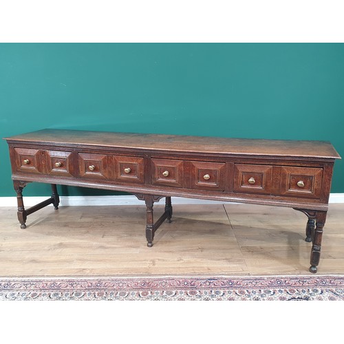 830 - A Charles II oak Dresser Base, fitted four moulded drawers on turned and squared supports and square... 