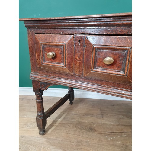 830 - A Charles II oak Dresser Base, fitted four moulded drawers on turned and squared supports and square... 