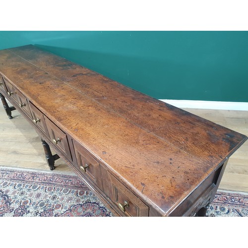 830 - A Charles II oak Dresser Base, fitted four moulded drawers on turned and squared supports and square... 