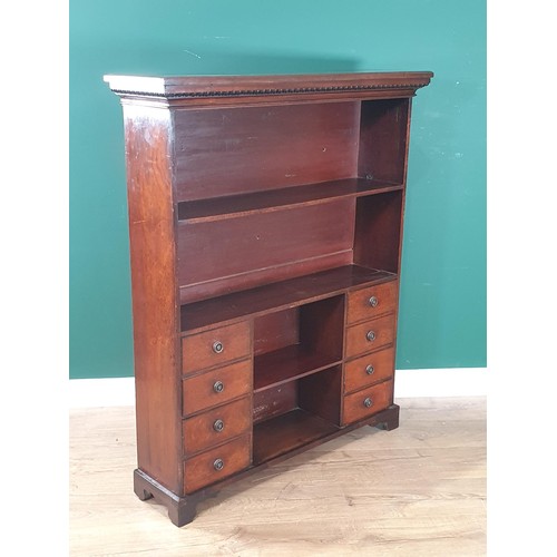 819 - A late Victorian mahogany small Bookcase with open shelves above two banks of four drawers flanking ... 