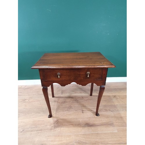 809 - A Georgian oak Lowboy with moulded top, with frieze drawer above a shaped frieze on slender cabriole... 