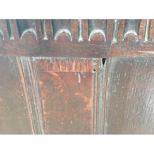 810 - A 17th Century oak small Coffer with hinged cover above a carved frieze and lozenge inlaid panels, 3... 