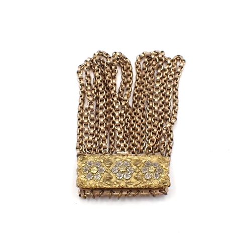 164 - A nine strand Bracelet made from a 9ct gold guard chain on embossed and engraved gilt metal clasp, a... 