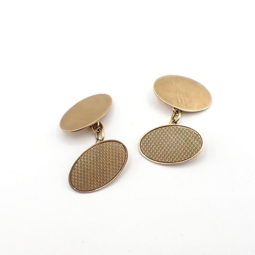 165 - A pair of 9ct gold oval Cufflinks with engine turning, approx 7gms