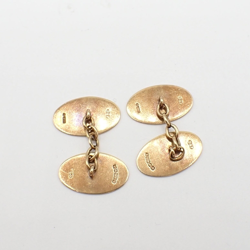 165 - A pair of 9ct gold oval Cufflinks with engine turning, approx 7gms