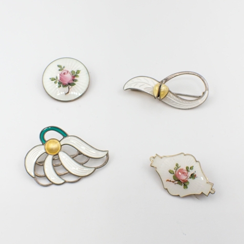 186 - Four silver and enamel Brooches, two depicting roses