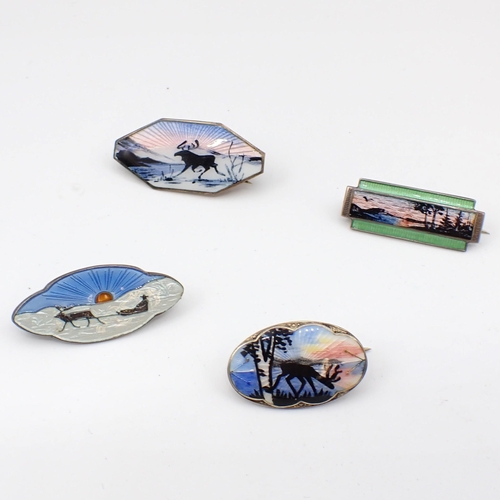 187 - Four small silver and enamel silhouette Brooches depicting reindeer in winter landscapes