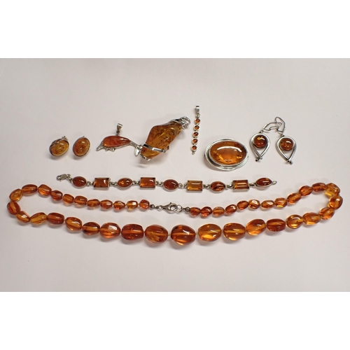 201 - A collection of modern amber and ambroid Jewellery including; graduated bead Necklace, Bracelet set ... 