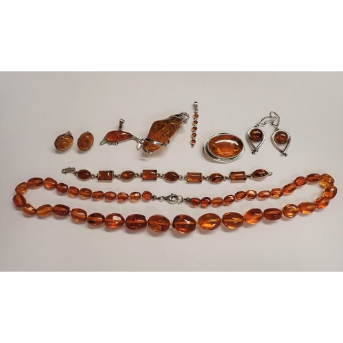 201 - A collection of modern amber and ambroid Jewellery including; graduated bead Necklace, Bracelet set ... 