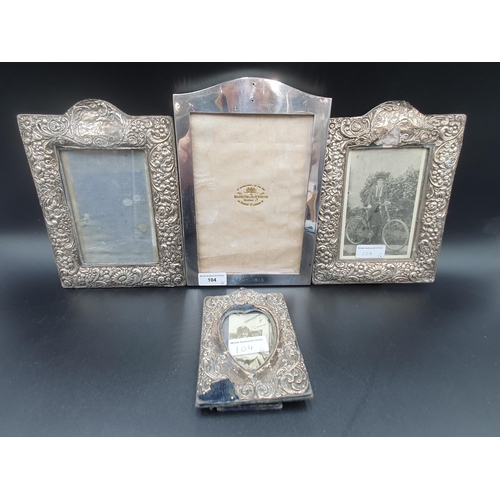 104 - A George V silver Photograph Frame, London 1916, 9 x 6in, pair of floral embossed Frames, Birmingham... 