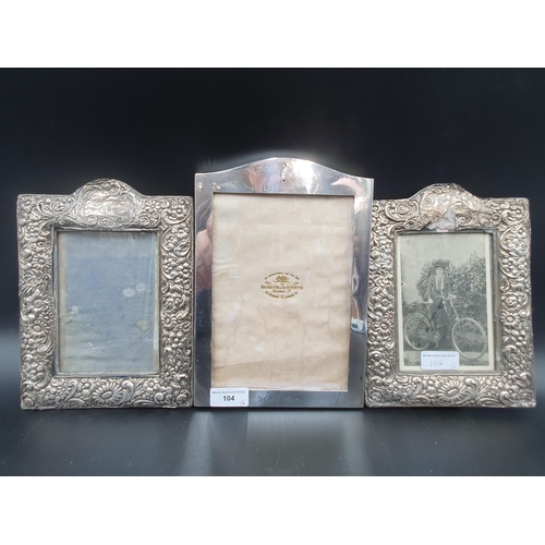 104 - A George V silver Photograph Frame, London 1916, 9 x 6in, pair of floral embossed Frames, Birmingham... 