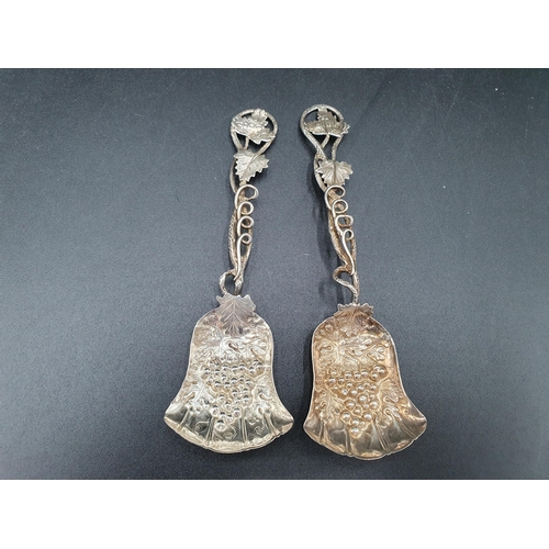 111 - A new pair of Victorian silver Spoons with fruiting vine embossed bell shape bowls, leafage and spir... 