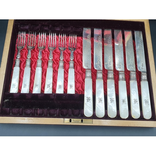 112 - Six Victorian silver Dessert Knives & Forks with leafage engraved silver blades, mother of pearl han... 