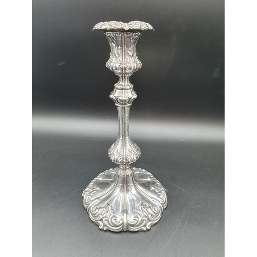 139 - A George III silver Candlestick with knopped stem on leafage scroll decorated shaped circular base, ... 