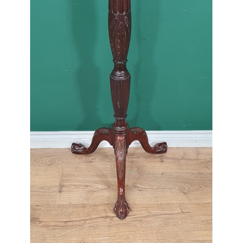 16 - A George III style mahogany Torchere with fluted column mounted on tripod supports with claw and bal... 