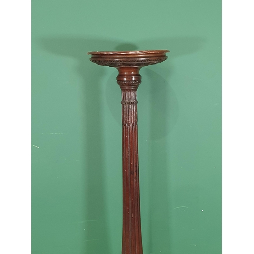 16 - A George III style mahogany Torchere with fluted column mounted on tripod supports with claw and bal... 