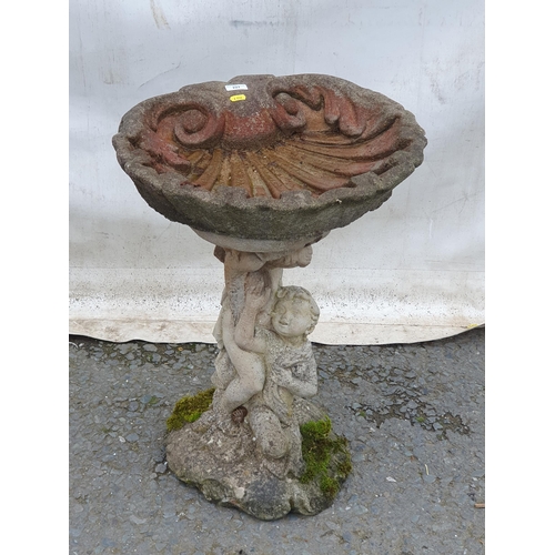 227 - A shell shaped topped composition Bird Bath with cherub supports