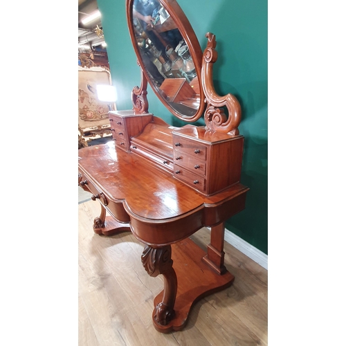 252 - A Victorian mahogany Dressing Table with oval mirror fitted six small drawers above single frieze dr... 