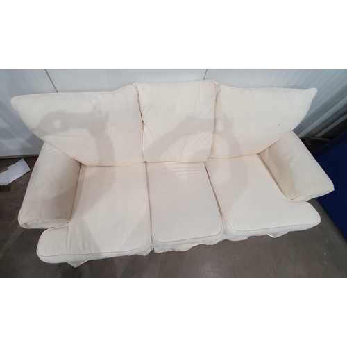 253 - A cream upholstered three seater Sofa 6ft 6in W x 2ft 11in H (R11)