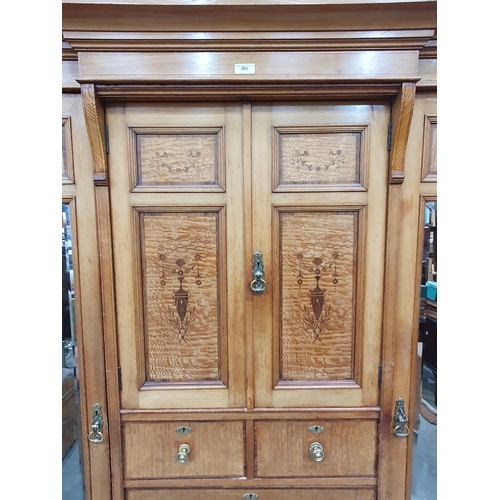 263 - A Victorian ash and satinwood Wardrobe with urn and swag inlay, fitted pair of mirror doors flanking... 