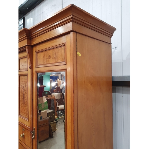 263 - A Victorian ash and satinwood Wardrobe with urn and swag inlay, fitted pair of mirror doors flanking... 