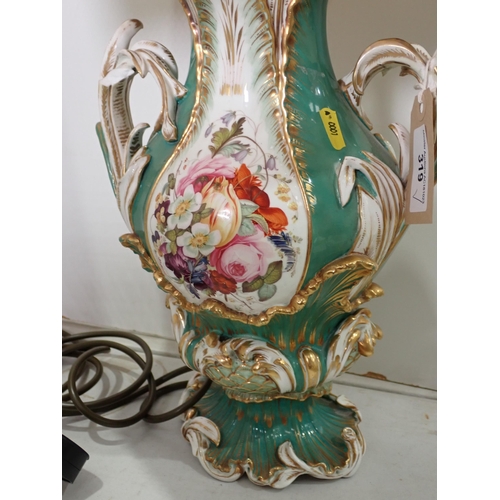 319 - A green glazed ceramic Table Lamp in the form of a Vase with floral painted design and leafage handl... 