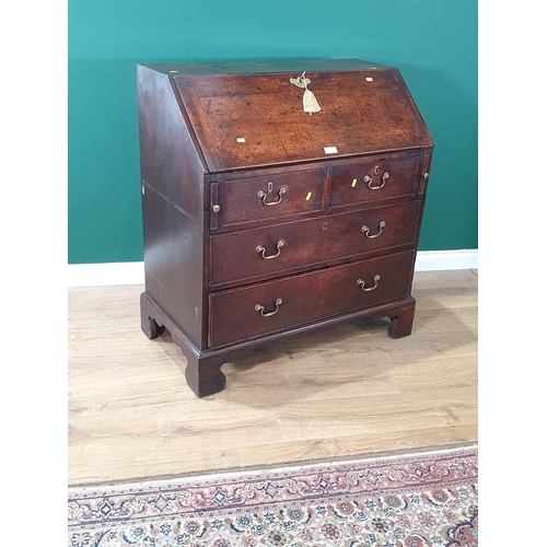 33 - A Georgian oak Bureau fitted two short and two long drawers raised on ogee bracket feet 3ft 4in H x ... 