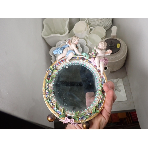 362 - A white banded Dairy Jug 10in H A/F, a floral encrusted Table Mirror, mounted with cherubs 10in A/F,... 