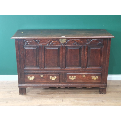 485 - An 18th Century oak Mule Chest with leafage carved frieze and fielded four panel front 4ft 8in W x 3... 