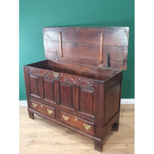 485 - An 18th Century oak Mule Chest with leafage carved frieze and fielded four panel front 4ft 8in W x 3... 