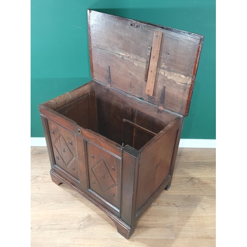 491 - A 17th Century oak Chest with hinged lid above diamond carved panel front on later bracket feet (som... 