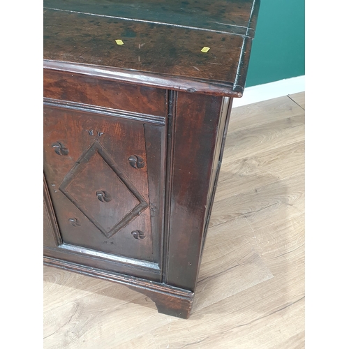 491 - A 17th Century oak Chest with hinged lid above diamond carved panel front on later bracket feet (som... 