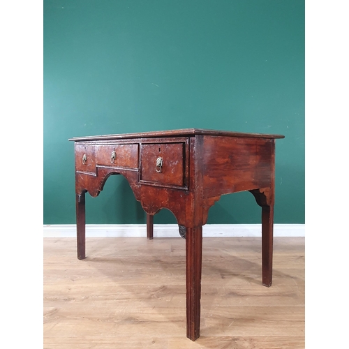 493 - An antique oak and burr oak veneered Side Table fitted three drawers above shaped apron raised on al... 