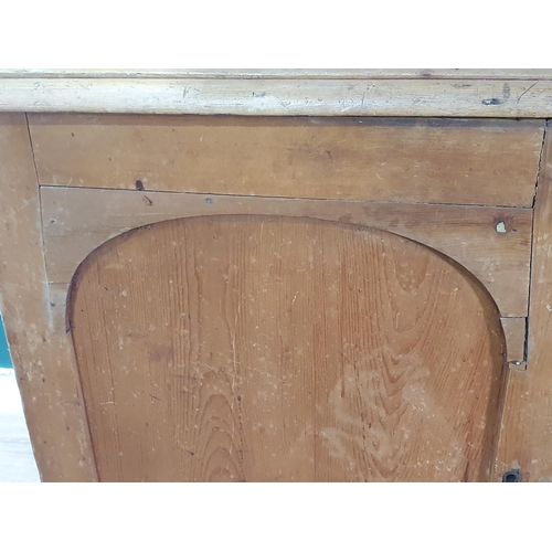 495 - A Victorian pine Dresser with glazed upper section above base fitted pair of arched panel doors flan... 