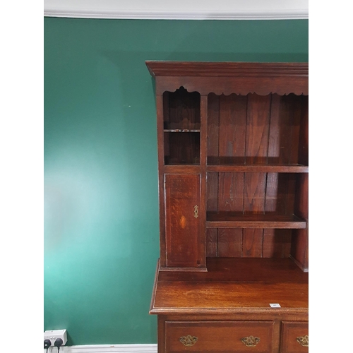 497 - A Georgian style oak and inlaid Dresser and Rack fitted two drawers above Cupid's bow shaped frieze ... 