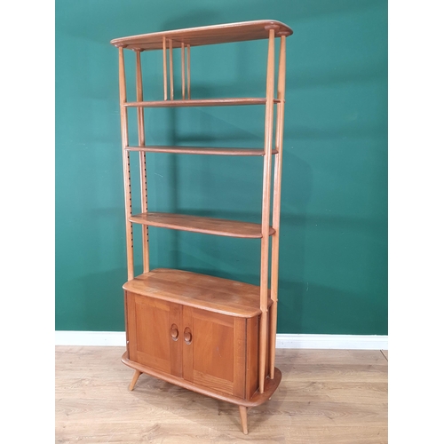 50 - A light elm Ercol 'Giraffe' Room Divider fitted two doors to base, label to inside of cupboard door,... 