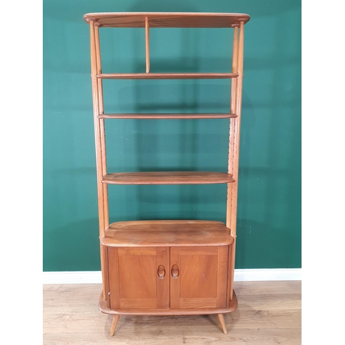 50 - A light elm Ercol 'Giraffe' Room Divider fitted two doors to base, label to inside of cupboard door,... 