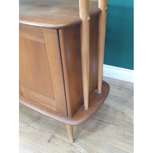 50 - A light elm Ercol 'Giraffe' Room Divider fitted two doors to base, label to inside of cupboard door,... 