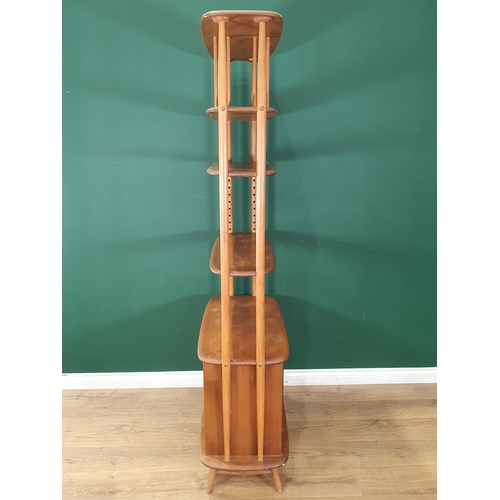 50 - A light elm Ercol 'Giraffe' Room Divider fitted two doors to base, label to inside of cupboard door,... 